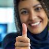 Samira Osman giving thumbs up in office